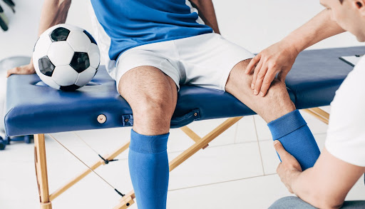 Athletic rehabilitation training with professional sports physiotherapist